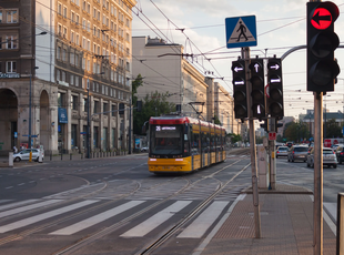Train of line 26 towards Wiatraczna pasing through an intersection